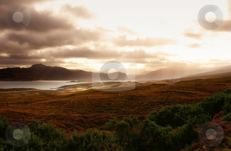 To use this stock image in your creative project, please select the size you need over to the right and click the "Add to Cart" button.
Your downloaded image will come with the Cutcaster watermark removed so don’t worry about the watermark you see on this page. Magic scotland stock photo, Magic scotland sunset over some hills and ocean by Karin Claus