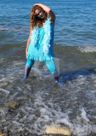 To use this stock image in your creative project, please select the size you need over to the right and click the "Add to Cart" button.
Your downloaded image will come with the Cutcaster watermark removed so don’t worry about the watermark you see on this page. The water girl. stock photo, The woman, representing water, dressed in blue, standing on the shore
of lake Ontario in bright sunshine and the waves coming to shore. by Horst Petzold