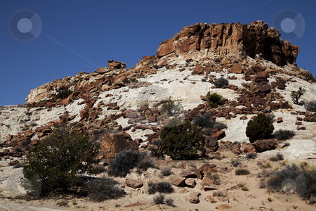 To use this stock image in your creative project, please select the size you need over to the right and click the "Add to Cart" button.
Your downloaded image will come with the Cutcaster watermark removed so don’t worry about the watermark you see on this page. San Rafael Swell stock photo, View of red rock formations in San Rafael Swell with blue sky by Mark Smith