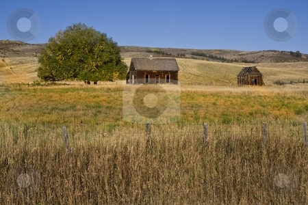 To use this stock image in your creative project, please select the size you need over to the right and click the "Add to Cart" button.
Your downloaded image will come with the Cutcaster watermark removed so don’t worry about the watermark you see on this page. Americana stock photo, Abandoned farm with hay fields surrionding it by Mark Smith