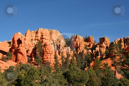 To use this stock image in your creative project, please select the size you need over to the right and click the "Add to Cart" button.
Your downloaded image will come with the Cutcaster watermark removed so don’t worry about the watermark you see on this page. Bryce Canyon stock photo, View of the red rock formations in Bryce Canyon National Park by Mark Smith