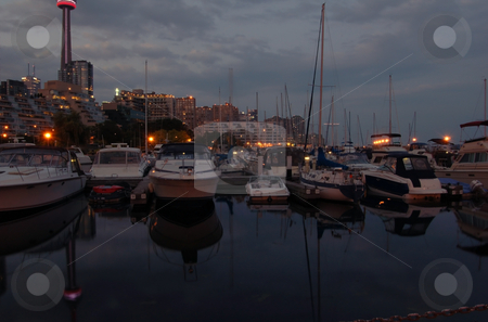 To use this stock image in your creative project, please select the size you need over to the right and click the "Add to Cart" button.
Your downloaded image will come with the Cutcaster watermark removed so don’t worry about the watermark you see on this page. The pier stock photo, Toronto water front in the night by Pavel Cheiko