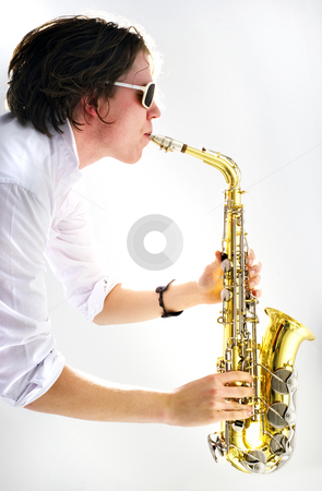 To use this stock image in your creative project, please select the size you need over to the right and click the "Add to Cart" button.
Your downloaded image will come with the Cutcaster watermark removed so don’t worry about the watermark you see on this page. Saxophone stock photo, A high key image of a saxophone player held vertical with a strong backlit light source by Corepics VOF
