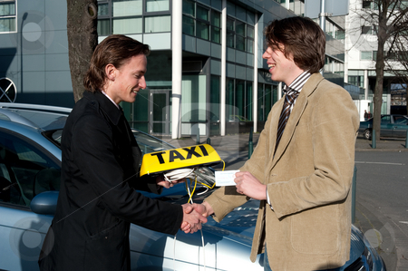 To use this stock image in your creative project, please select the size you need over to the right and click the "Add to Cart" button.
Your downloaded image will come with the Cutcaster watermark removed so don’t worry about the watermark you see on this page. Getting the taxi license stock photo, A government official handing a taxi license and sign to a newly appointed taxi driver whilst shaking his hand by Corepics VOF