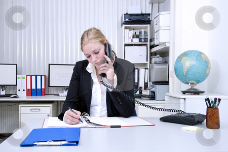 To use this stock image in your creative project, please select the size you need over to the right and click the "Add to Cart" button.
Your downloaded image will come with the Cutcaster watermark removed so don’t worry about the watermark you see on this page. Office work stock photo, A businesswoman on the phone and taking notes in an office environment by Corepics VOF