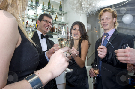 To use this stock image in your creative project, please select the size you need over to the right and click the "Add to Cart" button.
Your downloaded image will come with the Cutcaster watermark removed so don’t worry about the watermark you see on this page. New Years Eve Party stock photo, A group of five people celebrating new year at the bar in a club by Corepics VOF