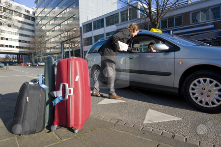 To use this stock image in your creative project, please select the size you need over to the right and click the "Add to Cart" button.
Your downloaded image will come with the Cutcaster watermark removed so don’t worry about the watermark you see on this page. Getting a ride stock photo, A businessman discussing his fare with a taxi driver by Corepics VOF