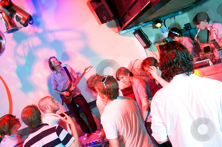 To use this stock image in your creative project, please select the size you need over to the right and click the "Add to Cart" button.
Your downloaded image will come with the Cutcaster watermark removed so don’t worry about the watermark you see on this page. Guitarist on stage stock photo, Guitarist on stage in a nightclub, with party crowd, saxophonist and DJ by Corepics VOF