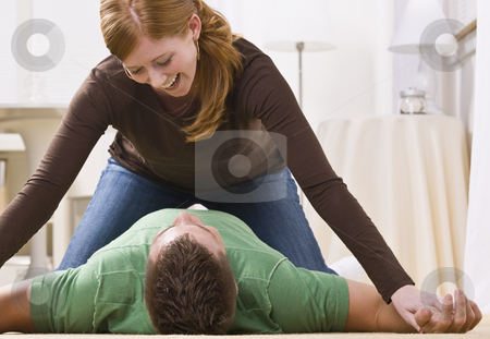 To use this stock image in your creative project, please select the size you need over to the right and click the "Add to Cart" button.
Your downloaded image will come with the Cutcaster watermark removed so don’t worry about the watermark you see on this page. Playful Redhead Pinning Man stock photo, A cute and playful redhead pinning a man to the floor. She is smiling down at him. Horizontally framed shot. by Jonathan Ross