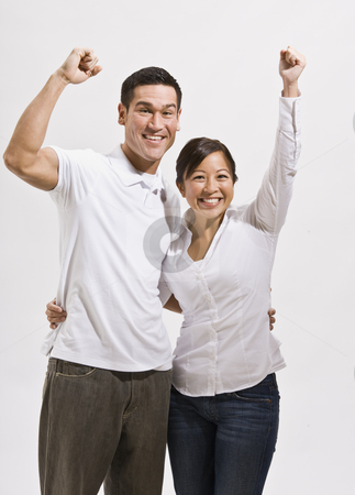 To use this stock image in your creative project, please select the size you need over to the right and click the "Add to Cart" button.
Your downloaded image will come with the Cutcaster watermark removed so don’t worry about the watermark you see on this page. Attractive Asian Couple Cheering stock photo, An attractive young asian couple cheering with their fists in the air. They are smiling at the camera. Vertically framed shot. by Jonathan Ross