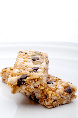 To use this stock image in your creative project, please select the size you need over to the right and click the "Add to Cart" button.
Your downloaded image will come with the Cutcaster watermark removed so don’t worry about the watermark you see on this page. Vertical close up of two granola bars on a white plate stock photo, Vertical close up of two granola bars on a white plate by Vince Clements