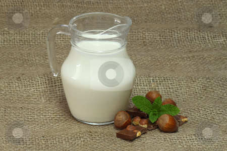 To use this stock image in your creative project, please select the size you need over to the right and click the "Add to Cart" button.
Your downloaded image will come with the Cutcaster watermark removed so don’t worry about the watermark you see on this page. Milk jug stock photo, Milk jug on brown background by Birgit Reitz-Hofmann