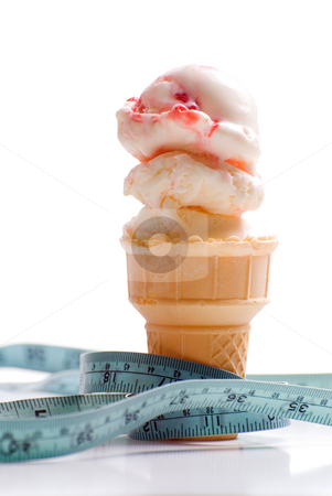 To use this stock image in your creative project, please select the size you need over to the right and click the "Add to Cart" button.
Your downloaded image will come with the Cutcaster watermark removed so don’t worry about the watermark you see on this page. Strawberry Ice Cream Diet stock photo, Concept image of a diet featuring an ice cream cone with strawberry ice cream and a measuring tape shot on white by Richard Nelson