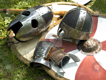 To use this stock image in your creative project, please select the size you need over to the right and click the "Add to Cart" button.
Your downloaded image will come with the Cutcaster watermark removed so don’t worry about the watermark you see on this page. Armor stock photo, Knight metal helmets over the stripped shield by Sergej Razvodovskij