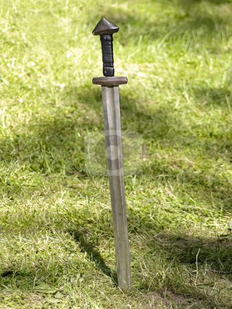 To use this stock image in your creative project, please select the size you need over to the right and click the "Add to Cart" button.
Your downloaded image will come with the Cutcaster watermark removed so don’t worry about the watermark you see on this page. Sword stock photo, Old metal sword in the green grass by Sergej Razvodovskij