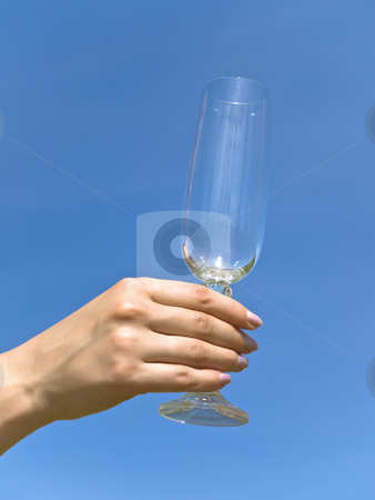 To use this stock image in your creative project, please select the size you need over to the right and click the "Add to Cart" button.
Your downloaded image will come with the Cutcaster watermark removed so don’t worry about the watermark you see on this page. Wineglass stock photo, Empty wineglass in woman hand against the blue sky by Sergej Razvodovskij