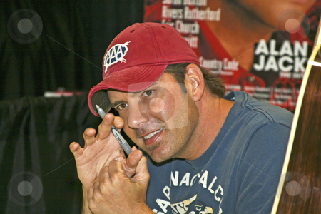 To use this stock image in your creative project, please select the size you need over to the right and click the "Add to Cart" button.
Your downloaded image will come with the Cutcaster watermark removed so don’t worry about the watermark you see on this page. Rodney Atkins - CMA Festival 2009 stock photo, Rodney Atkins at the CMA Festival June 11-14, 2009 in Nashville, Tennessee signing autographs by Dennis Crumrin