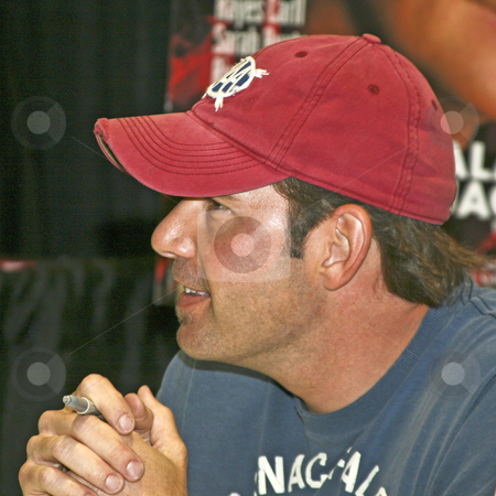 To use this stock image in your creative project, please select the size you need over to the right and click the "Add to Cart" button.
Your downloaded image will come with the Cutcaster watermark removed so don’t worry about the watermark you see on this page. Rodney Atkins - CMA Festival 2009 stock photo, Rodney Atkins at the CMA Festival 2009 in Nashville, Tennessee signing autographs by Dennis Crumrin