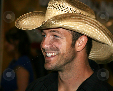 To use this stock image in your creative project, please select the size you need over to the right and click the "Add to Cart" button.
Your downloaded image will come with the Cutcaster watermark removed so don’t worry about the watermark you see on this page. Kyle Jennings - CMA Music Festival 2009 stock photo, Kyle Jennings at the CMA Festival 2009 in Nashville, Tennessee signing autographs by Dennis Crumrin
