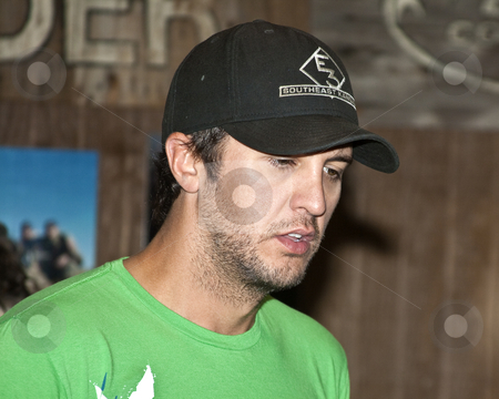 To use this stock image in your creative project, please select the size you need over to the right and click the "Add to Cart" button.
Your downloaded image will come with the Cutcaster watermark removed so don’t worry about the watermark you see on this page. Luke Bryan - CMA Festival 2009 stock photo, Luke Bryan at the CMA Festival 2009 in Nashville, Tennessee signing autographs by Dennis Crumrin