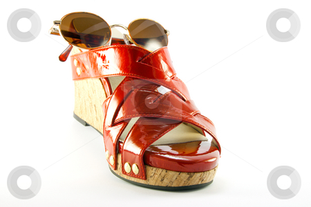 To use this stock image in your creative project, please select the size you need over to the right and click the "Add to Cart" button.
Your downloaded image will come with the Cutcaster watermark removed so don’t worry about the watermark you see on this page. Red Shoe and Sunglasses stock photo, Single red shoe and brown sunglasses with clipping path on a white background by Keith Wilson