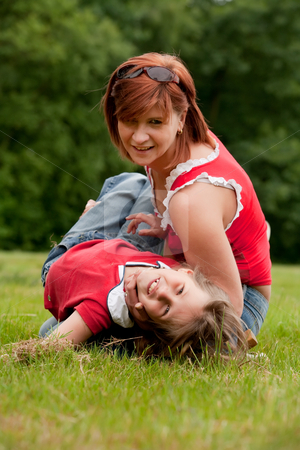 To use this stock image in your creative project, please select the size you need over to the right and click the "Add to Cart" button.
Your downloaded image will come with the Cutcaster watermark removed so don’t worry about the watermark you see on this page. Playing with my mom stock photo, Mother and Daughter are happy in the park by Frenk and Danielle Kaufmann