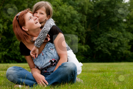 To use this stock image in your creative project, please select the size you need over to the right and click the "Add to Cart" button.
Your downloaded image will come with the Cutcaster watermark removed so don’t worry about the watermark you see on this page. Kissing my mom stock photo, Mother and Daughter are happy in the park by Frenk and Danielle Kaufmann