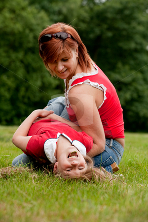 To use this stock image in your creative project, please select the size you need over to the right and click the "Add to Cart" button.
Your downloaded image will come with the Cutcaster watermark removed so don’t worry about the watermark you see on this page. Smiling with my mother stock photo, Mother and Daughter are happy in the park by Frenk and Danielle Kaufmann