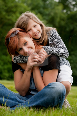To use this stock image in your creative project, please select the size you need over to the right and click the "Add to Cart" button.
Your downloaded image will come with the Cutcaster watermark removed so don’t worry about the watermark you see on this page. Happy girl with her mom stock photo, Mother and Daughter are happy in the park by Frenk and Danielle Kaufmann
