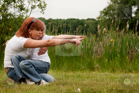 To use this stock image in your creative project, please select the size you need over to the right and click the "Add to Cart" button.
Your downloaded image will come with the Cutcaster watermark removed so don’t worry about the watermark you see on this page. Pointing together stock photo, Mother and Daughter are happy in the park by Frenk and Danielle Kaufmann