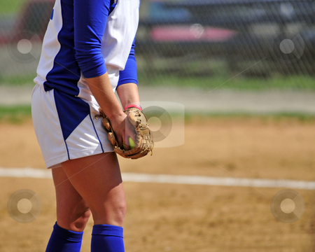 To use this stock image in your creative project, please select the size you need over to the right and click the "Add to Cart" button.
Your downloaded image will come with the Cutcaster watermark removed so don’t worry about the watermark you see on this page. Ready to pitch stock photo, Mid body view of a woman softball pitcher preparing to pitch. by W. Paul Thomas