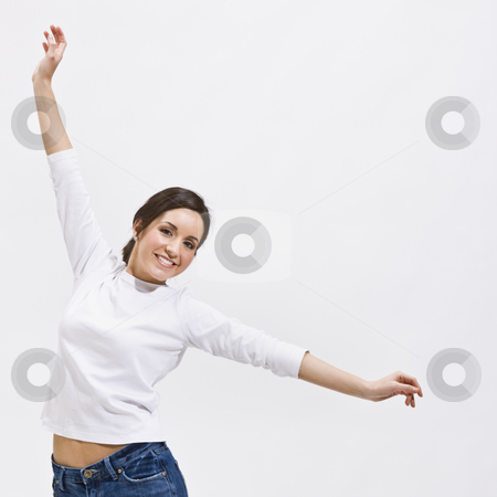 To use this stock image in your creative project, please select the size you need over to the right and click the "Add to Cart" button.
Your downloaded image will come with the Cutcaster watermark removed so don’t worry about the watermark you see on this page. Woman with Outstretched Arms stock photo, An attractive young woman posing with outstretched arms. She is smiling and is looking directly at the camera. Square framed photo. by Jonathan Ross