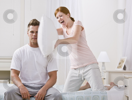 To use this stock image in your creative project, please select the size you need over to the right and click the "Add to Cart" button.
Your downloaded image will come with the Cutcaster watermark removed so don’t worry about the watermark you see on this page. Cute Redhead Hitting with Pillow stock photo, A cute and young redhead hitting her boyfriend with a pillow. She has a joyful look on her face. His expression is serious. Horizontally framed shot. by Jonathan Ross