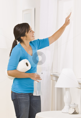 To use this stock image in your creative project, please select the size you need over to the right and click the "Add to Cart" button.
Your downloaded image will come with the Cutcaster watermark removed so don’t worry about the watermark you see on this page. Cute Brunette Washing Window stock photo, A cute young brunette washing a window in her home. She is smiling and is using paper towels. Vertically framed shot. by Jonathan Ross
