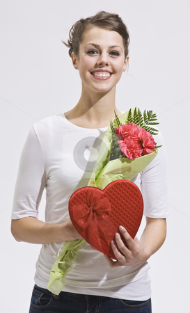 To use this stock image in your creative project, please select the size you need over to the right and click the "Add to Cart" button.
Your downloaded image will come with the Cutcaster watermark removed so don’t worry about the watermark you see on this page. Attractive woman and valentines day gifts stock photo, Attractive woman with flowers and heart-shaped candy box. Vertically framed shot. by Jonathan Ross