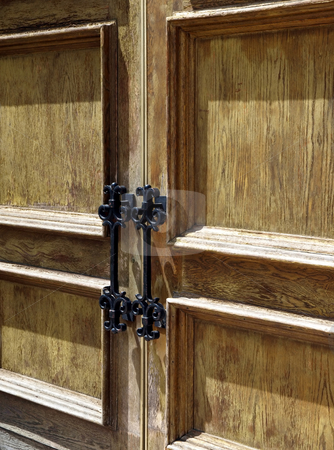 To use this stock image in your creative project, please select the size you need over to the right and click the "Add to Cart" button.
Your downloaded image will come with the Cutcaster watermark removed so don’t worry about the watermark you see on this page. Rustic wooden doors with metal handles stock photo, Close-up view of rustic weathered wooden doors with iron metal handles by Jill Reid