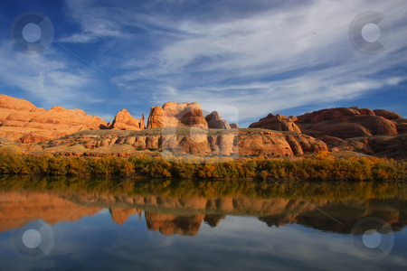 To use this stock image in your creative project, please select the size you need over to the right and click the "Add to Cart" button.
Your downloaded image will come with the Cutcaster watermark removed so don’t worry about the watermark you see on this page. Colorado River stock photo, View of the red rock formations in Canyonlands National Park with blue sky by Mark Smith