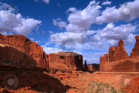 To use this stock image in your creative project, please select the size you need over to the right and click the "Add to Cart" button.
Your downloaded image will come with the Cutcaster watermark removed so don’t worry about the watermark you see on this page. Arches National Park stock photo, View of the red rock formations in Arches National Park with blue sky by Mark Smith