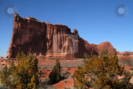 To use this stock image in your creative project, please select the size you need over to the right and click the "Add to Cart" button.
Your downloaded image will come with the Cutcaster watermark removed so don’t worry about the watermark you see on this page. Red Rock Dsesert stock photo, View of the red rock formations in Arches National Park with blue sky by Mark Smith