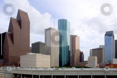 To use this stock image in your creative project, please select the size you need over to the right and click the "Add to Cart" button.
Your downloaded image will come with the Cutcaster watermark removed so don’t worry about the watermark you see on this page. Downtown Houston stock photo, Downtown houston texas with a cloudy sky by Brandon Seidel