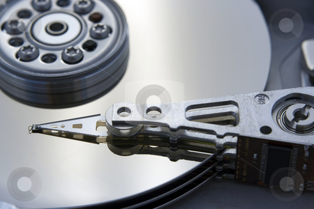 To use this stock image in your creative project, please select the size you need over to the right and click the "Add to Cart" button.
Your downloaded image will come with the Cutcaster watermark removed so don’t worry about the watermark you see on this page. Computer Harddrive stock photo, A close up macro of an opened computer harddrive. by Brandon Seidel