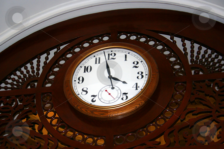 To use this stock image in your creative project, please select the size you need over to the right and click the "Add to Cart" button.
Your downloaded image will come with the Cutcaster watermark removed so don’t worry about the watermark you see on this page. Clock stock photo, A wooden clock mounted on the ceiling of the state capitol building. by Brandon Seidel