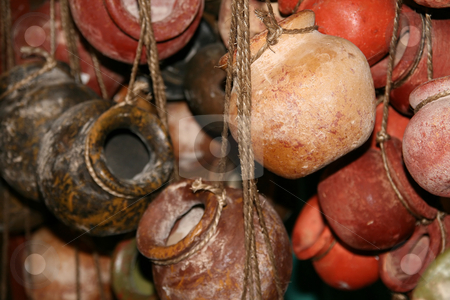 To use this stock image in your creative project, please select the size you need over to the right and click the "Add to Cart" button.
Your downloaded image will come with the Cutcaster watermark removed so don’t worry about the watermark you see on this page. Hanging Clay Mexican Pots stock photo, Multiple strands of hanging clay mexican pots. by Brandon Seidel