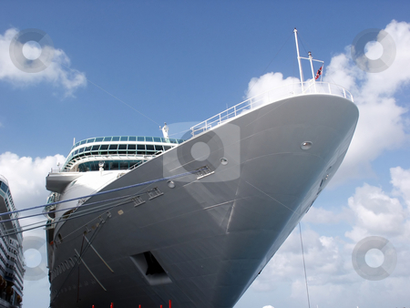 To use this stock image in your creative project, please select the size you need over to the right and click the "Add to Cart" button.
Your downloaded image will come with the Cutcaster watermark removed so don’t worry about the watermark you see on this page. Cruise Ship stock photo, A cruise ship docked at port. by Brandon Seidel