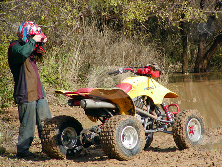 To use this stock image in your creative project, please select the size you need over to the right and click the "Add to Cart" button.
Your downloaded image will come with the Cutcaster watermark removed so don’t worry about the watermark you see on this page. ATV Muddy Trails stock photo, A shot of a young man riding some muddy trails on his ATV. by Brandon Seidel