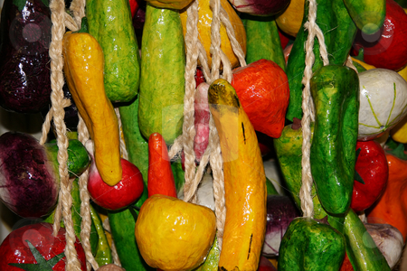 To use this stock image in your creative project, please select the size you need over to the right and click the "Add to Cart" button.
Your downloaded image will come with the Cutcaster watermark removed so don’t worry about the watermark you see on this page. Hanging Vegetables stock photo, Multiple strands of hanging fake vegetables. by Brandon Seidel