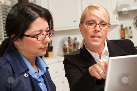 To use this stock image in your creative project, please select the size you need over to the right and click the "Add to Cart" button.
Your downloaded image will come with the Cutcaster watermark removed so don’t worry about the watermark you see on this page. Businesswomen Working on the Laptop stock photo, Businesswomen Working on the Laptop Together in the Kitchen. by Andy Dean