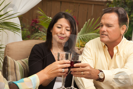 To use this stock image in your creative project, please select the size you need over to the right and click the "Add to Cart" button.
Your downloaded image will come with the Cutcaster watermark removed so don’t worry about the watermark you see on this page. Three Friends Enjoying Wine on the Patio stock photo, Three Friends Enjoying Wine on an Outdoor Patio. by Andy Dean