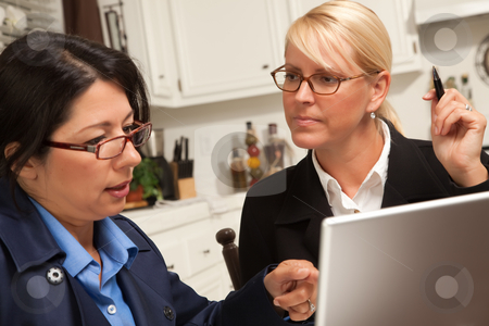 To use this stock image in your creative project, please select the size you need over to the right and click the "Add to Cart" button.
Your downloaded image will come with the Cutcaster watermark removed so don’t worry about the watermark you see on this page. Businesswomen Working on the Laptop stock photo, Businesswomen Working on the Laptop Together in the Kitchen. by Andy Dean