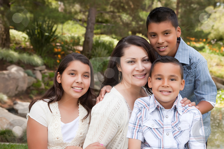To use this stock image in your creative project, please select the size you need over to the right and click the "Add to Cart" button.
Your downloaded image will come with the Cutcaster watermark removed so don’t worry about the watermark you see on this page. Happy Mother and Children in the Park stock photo, Happy Hispanic Mother and Children in the Park. by Andy Dean